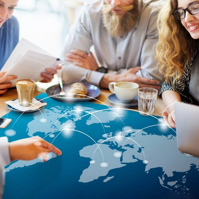 Team discussing global travel plans with immigration consultants in kerala